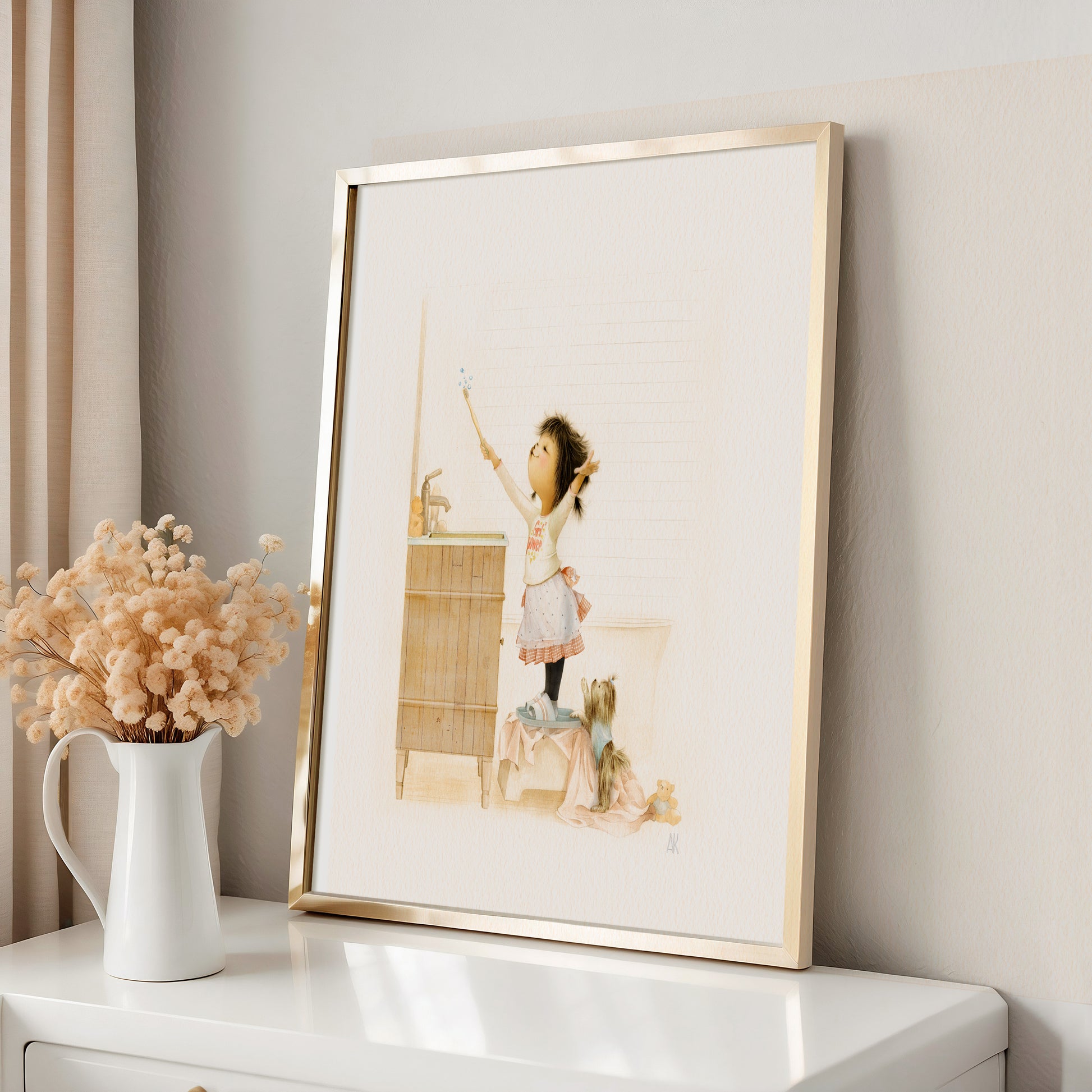 Framed artwork of a girl in a kitchen on a white surface with a vase of flowers.