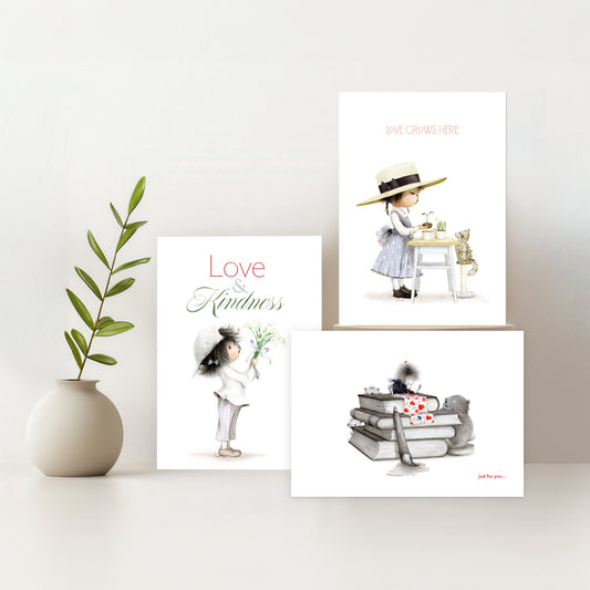 Three illustrated cards on a white surface with a vase containing green leaves.