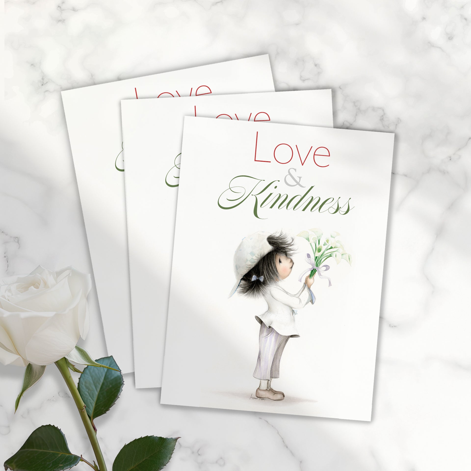 Three 'Love & Kindness' themed cards with an illustration of a child holding flowers on a marble surface.