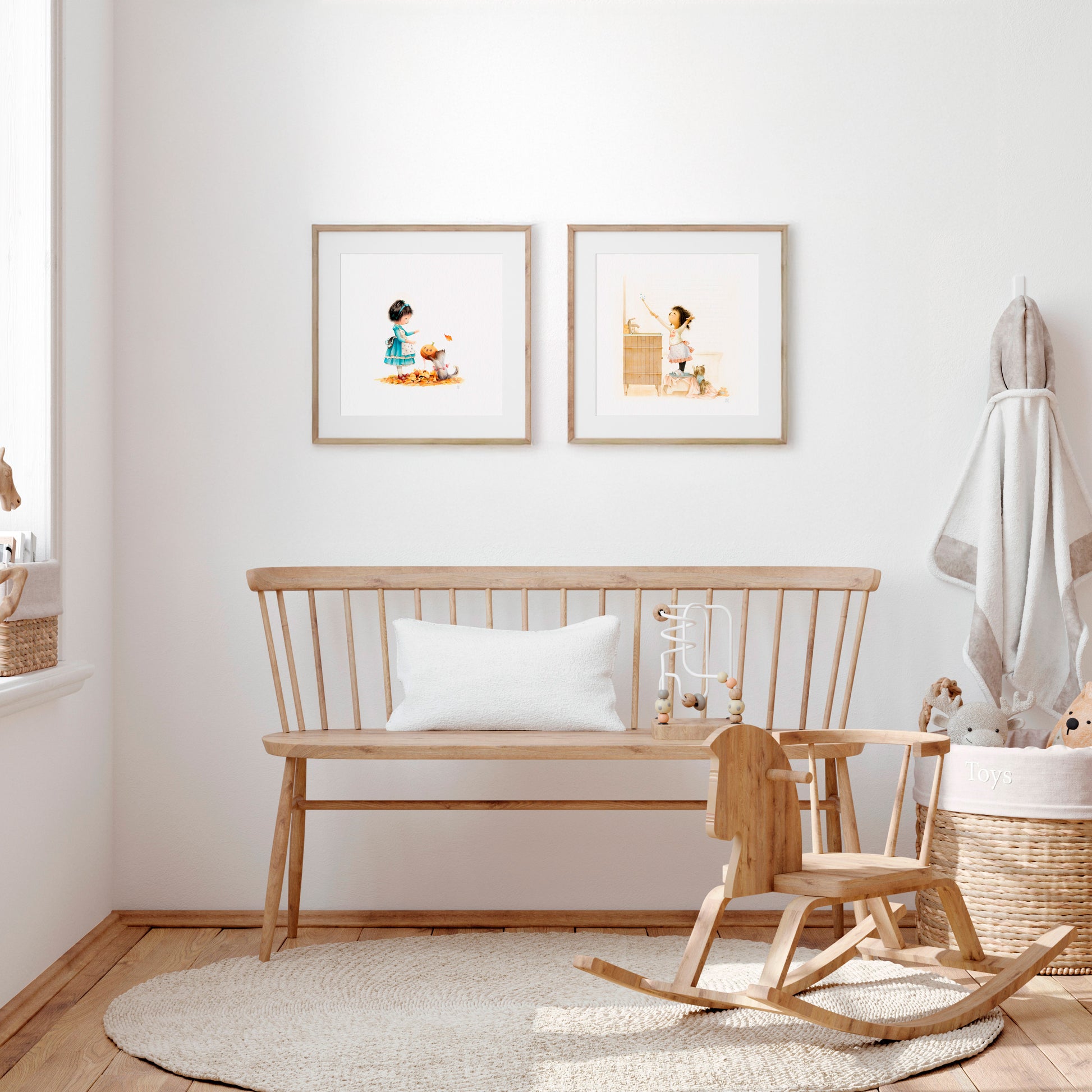 Nursery room with wooden bench, rocking chair, and framed pictures of Danbi on a white wall.