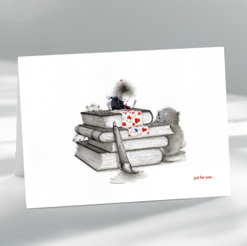 Greeting card with illustration of books and a cat on a gray background