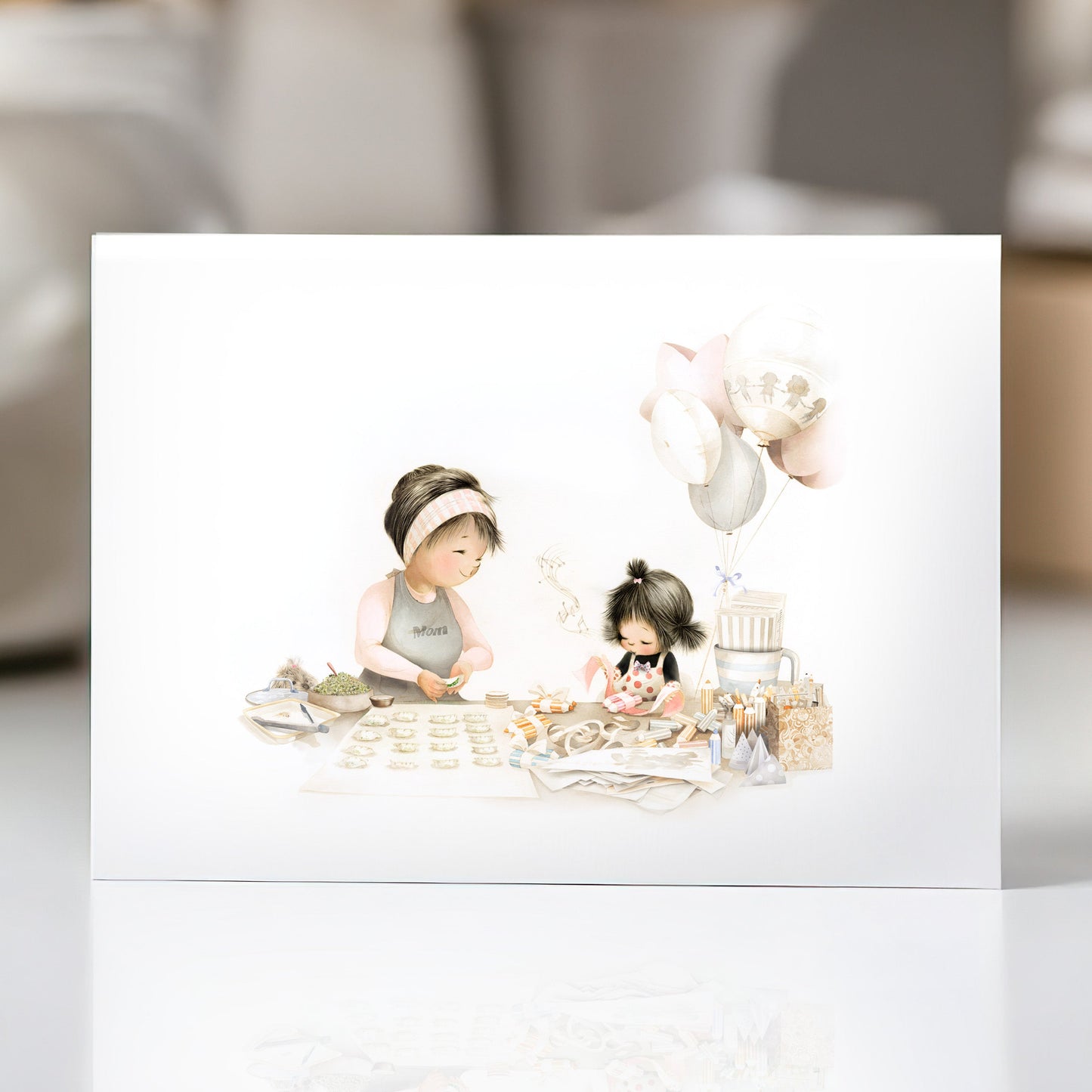 Greeting Card with figurines of a mother and child at a table on a white surface.